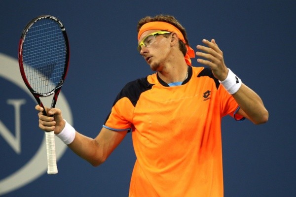 Denis Istomin durante partida. Foto: Getty Images