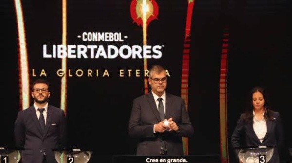 LUQUE, PARAGUAY - MARCH 25: Frederico Nantes Director of Clubs Competitions draws out a card during the Copa CONMEBOL Libertadores and Sudamericana draw on March 25, 2022 in Luque, Paraguay. (Photo by Christian Alvarenga/Getty Images)