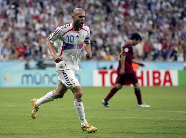 MUNICH, GERMANY - JULY 05:  Zinedine Zidane #10 (L) of France celebrates after scoring the opening goal from the penalty spot during the FIFA World Cup Germany 2006 Semi-final match between Portugal and France at the Stadium Munich on July 5, 2006 in Munich, Germany.  (Photo by Michael Steele/Getty Images)